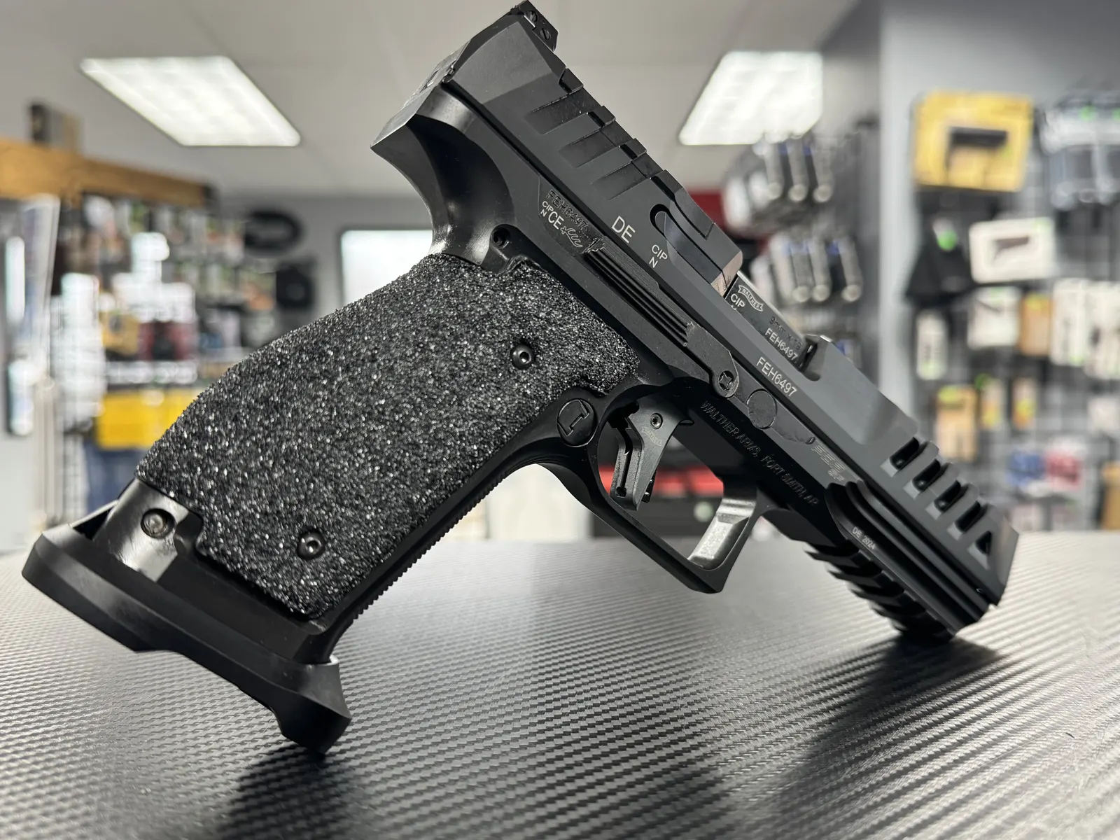 Pistol with full grip stippling and lightening cuts